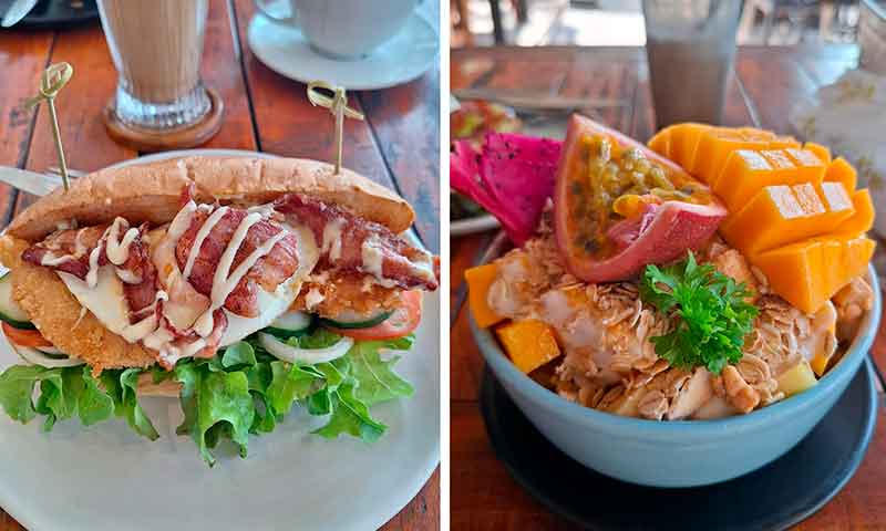 Un sándwich y un bowl de frutas en un restaurante de Koh Tao